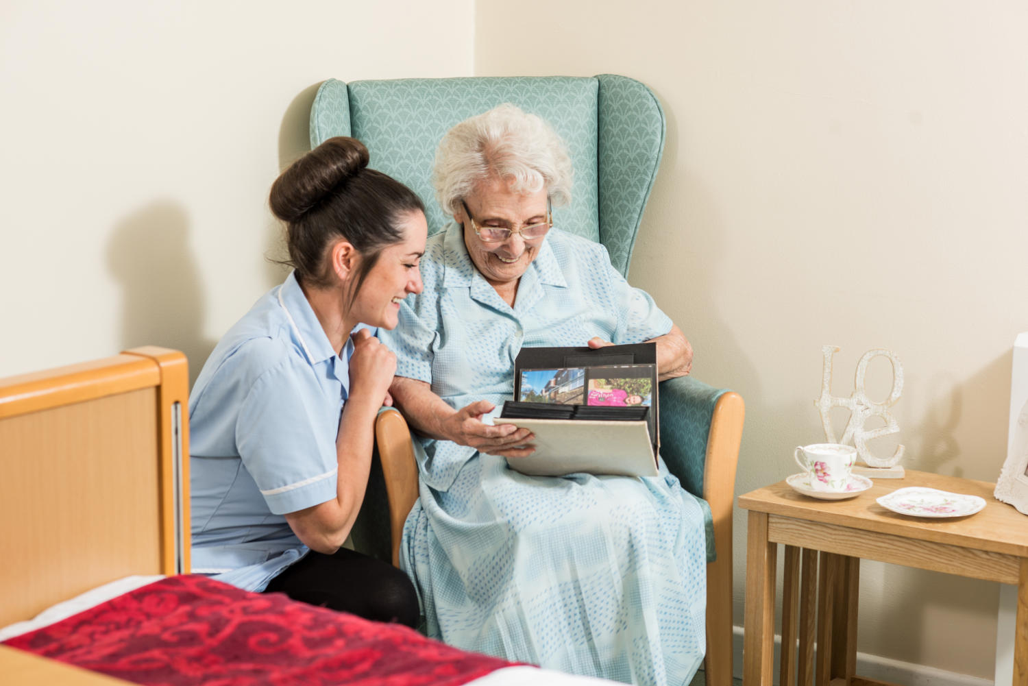 Staff sharing memories with a resident